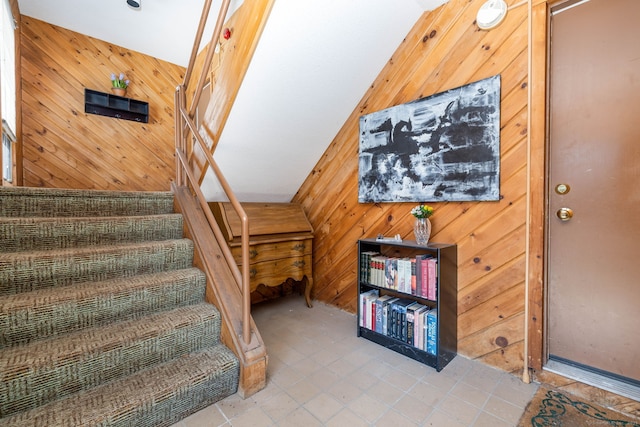 stairs with wood walls