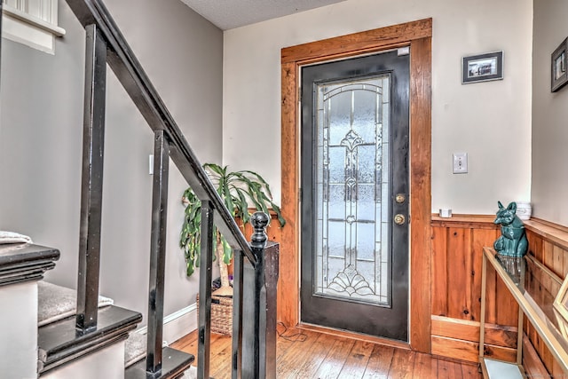 foyer featuring stairs and hardwood / wood-style floors