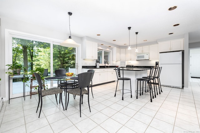 dining room featuring light tile patterned floors