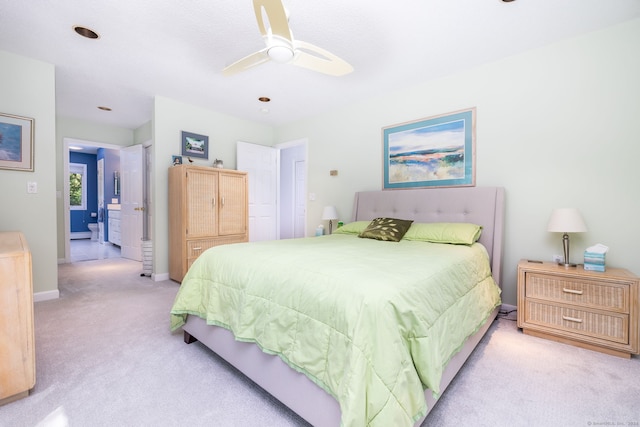 carpeted bedroom featuring baseboards and ceiling fan