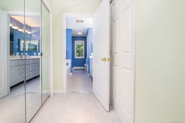 47 Jeremy River Dr, Colchester, CT 06415 - corridor featuring light carpet, a baseboard heating unit, and baseboards