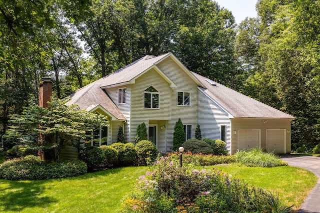 47 Jeremy River Dr, Colchester, CT 06415 - traditional-style house with a chimney, driveway, a garage, and a shingled roof