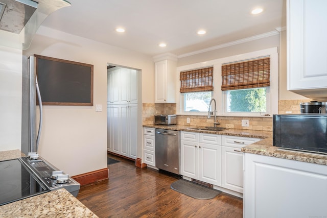 kitchen featuring decorative backsplash, stainless steel dishwasher, dark wood-style floors, white cabinetry, and a sink