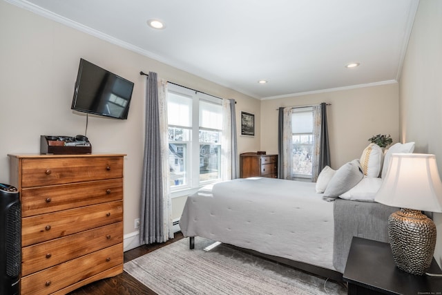 bedroom with multiple windows, wood finished floors, and crown molding