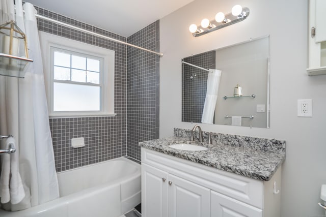 bathroom with vanity, toilet, and shower / bathtub combination with curtain