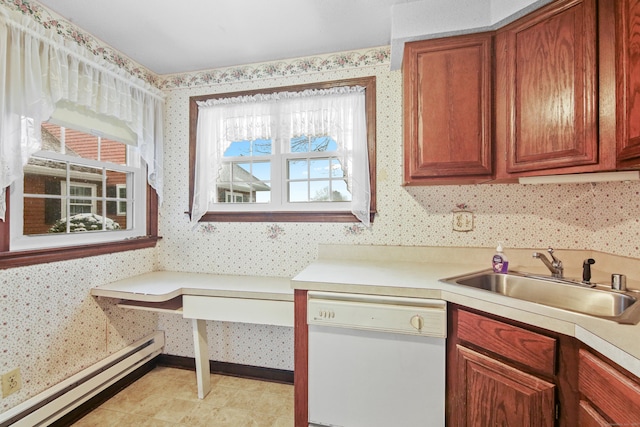 kitchen featuring a baseboard radiator, wallpapered walls, white dishwasher, a sink, and light countertops