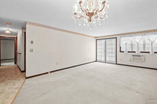 unfurnished living room featuring light carpet, an inviting chandelier, a wall mounted AC, and baseboards