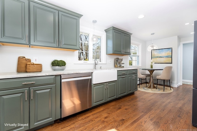 kitchen featuring decorative light fixtures, dishwasher, light countertops, and dark wood-style flooring