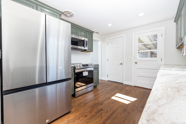 kitchen featuring visible vents, dark wood finished floors, recessed lighting, stainless steel appliances, and green cabinetry