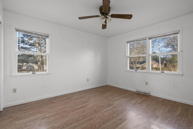 unfurnished room featuring visible vents, baseboards, light wood-style floors, and a ceiling fan