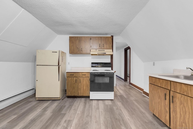 kitchen with white appliances, a sink, light countertops, under cabinet range hood, and baseboard heating