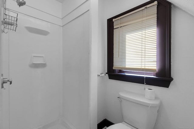 full bath with toilet and a stall shower