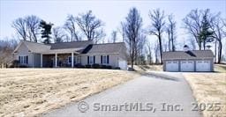 18 Bellawood Dr, Enfield, CT 06082 - view of front of home featuring an outbuilding, a garage, and driveway