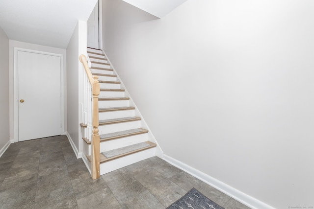 stairway with baseboards