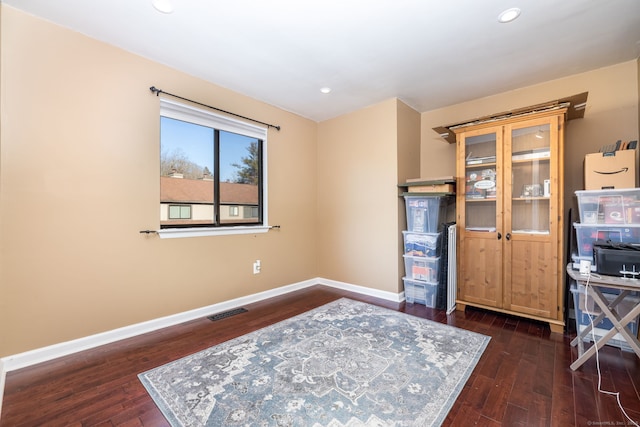 interior space with visible vents, recessed lighting, baseboards, and wood-type flooring