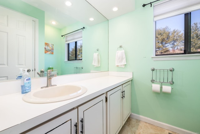 bathroom featuring recessed lighting, baseboards, vanity, and tile patterned floors