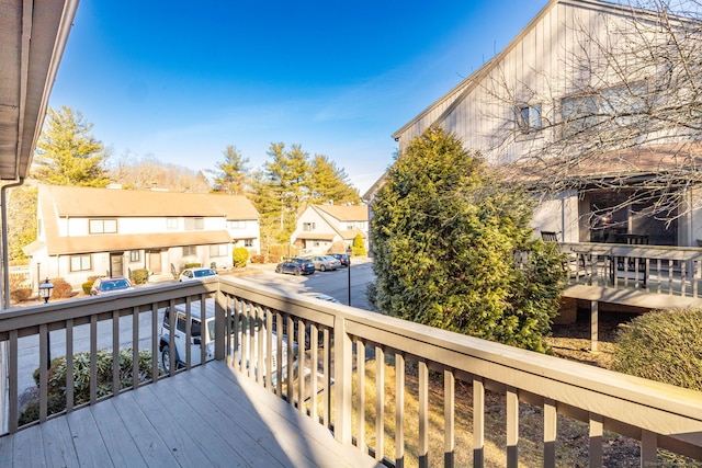 wooden deck with a residential view