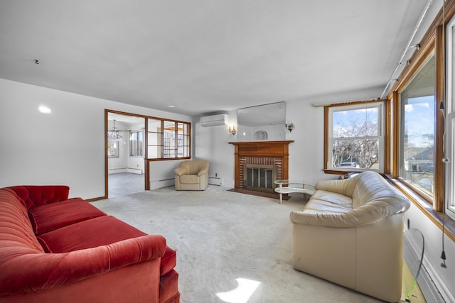 living room featuring a wall mounted AC, a brick fireplace, carpet flooring, and a healthy amount of sunlight