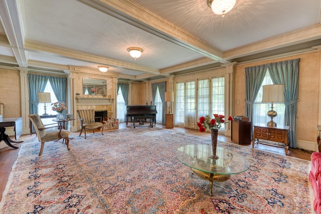 673 Spring St, Manchester, CT 06040 - living area with ornamental molding, healthy amount of natural light, beamed ceiling, coffered ceiling, and wood finished floors