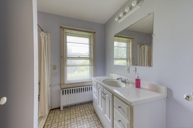 673 Spring St, Manchester, CT 06040 - full bath featuring radiator, vanity, and a shower with curtain