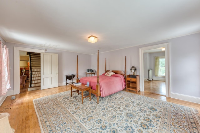 673 Spring St, Manchester, CT 06040 - bedroom featuring light wood-type flooring, ornamental molding, and baseboards