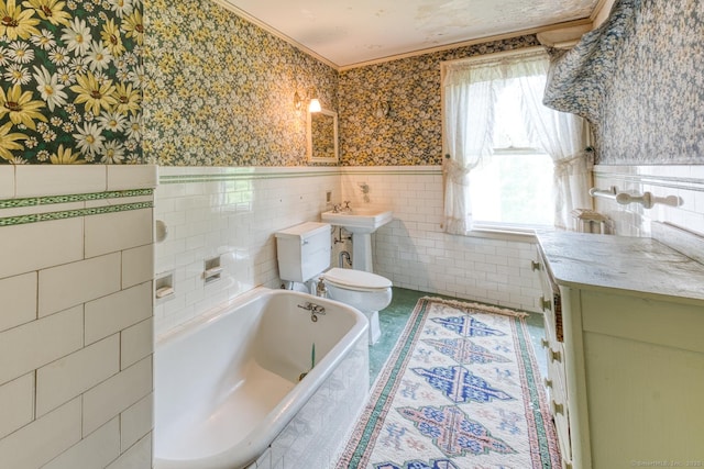 673 Spring St, Manchester, CT 06040 - bathroom with wallpapered walls, toilet, a relaxing tiled tub, tile walls, and crown molding