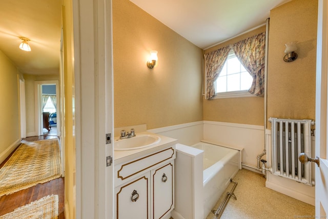 673 Spring St, Manchester, CT 06040 - full bathroom with a garden tub and vanity
