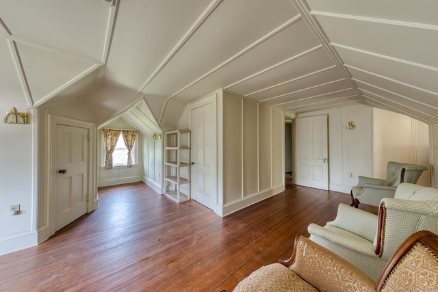 673 Spring St, Manchester, CT 06040 - additional living space featuring vaulted ceiling, wood finished floors, and a decorative wall