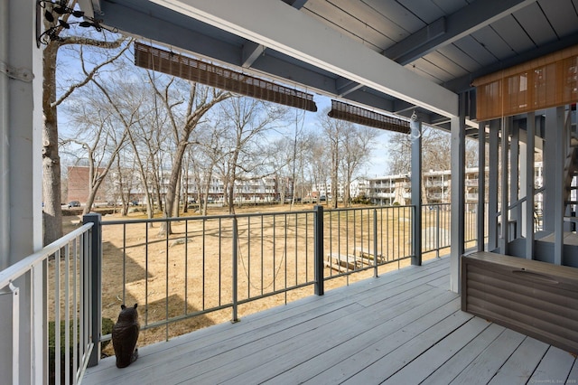 wooden terrace featuring a residential view