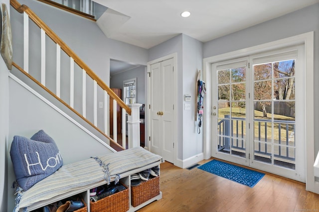 entryway featuring stairs, recessed lighting, wood finished floors, and baseboards