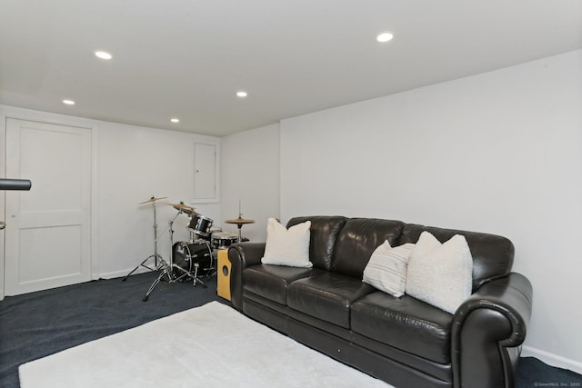 living area featuring recessed lighting, baseboards, and carpet