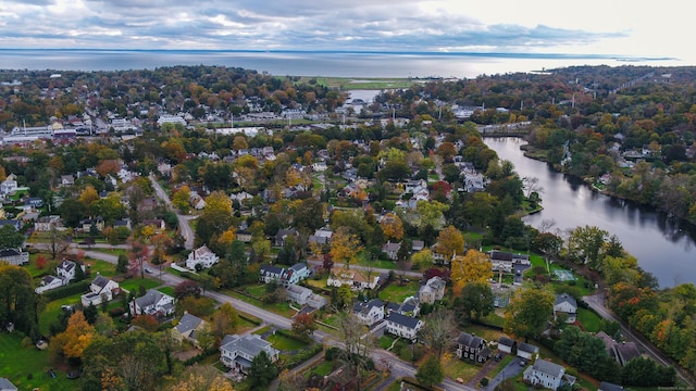 birds eye view of property with a water view and a residential view