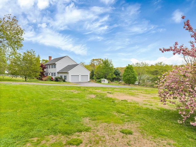 686 W Rd, Salem, CT 06420 - view of green lawn with driveway and a garage