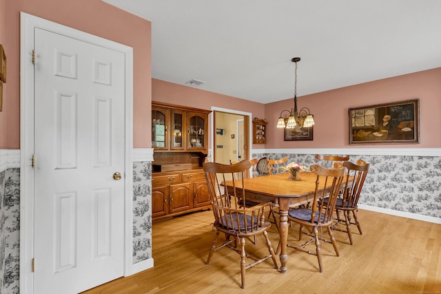 686 W Rd, Salem, CT 06420 - dining room with light wood-style floors, a chandelier, baseboards, wainscoting, and wallpapered walls