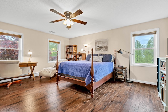 686 W Rd, Salem, CT 06420 - bedroom with dark wood-type flooring, baseboards, ceiling fan, and a baseboard radiator
