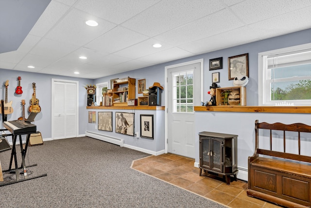 686 W Rd, Salem, CT 06420 - living room with a wood stove, a baseboard heating unit, carpet, a paneled ceiling, and recessed lighting