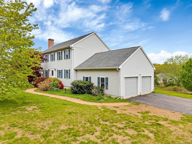 686 W Rd, Salem, CT 06420 - view of property exterior with a chimney, asphalt driveway, an attached garage, roof with shingles, and a yard