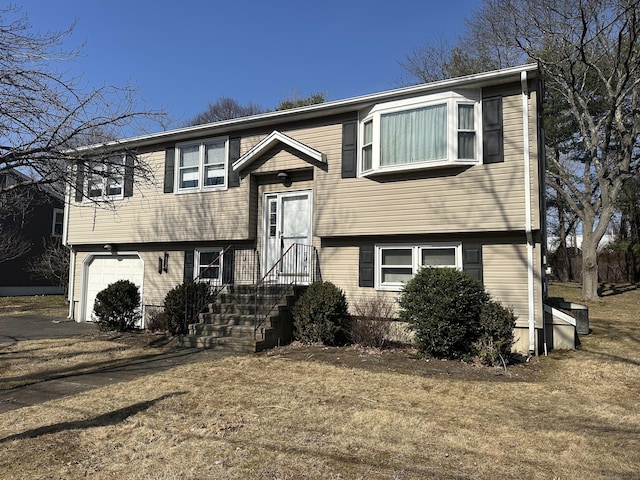 split foyer home featuring a garage