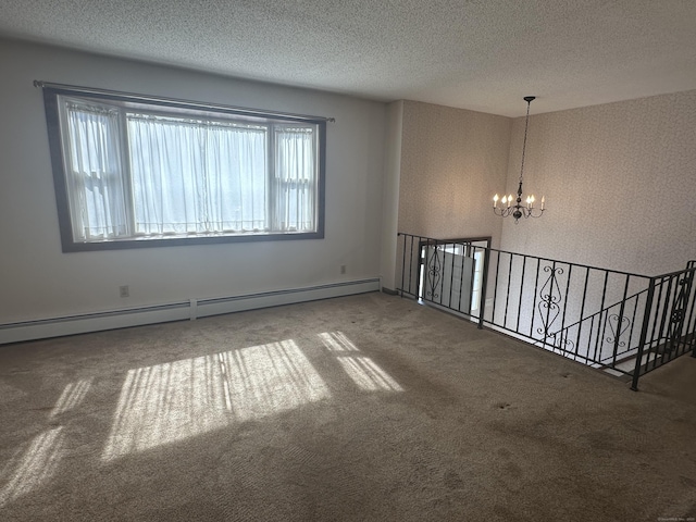 unfurnished room with a notable chandelier, a textured ceiling, carpet, and a baseboard radiator