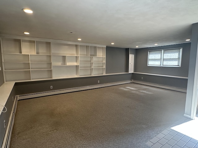 empty room featuring recessed lighting and a baseboard heating unit