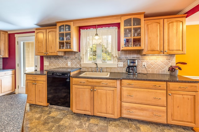 kitchen with glass insert cabinets, black dishwasher, decorative backsplash, stone finish floor, and a sink