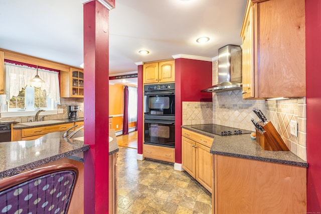 kitchen featuring black appliances, a sink, wall chimney exhaust hood, decorative backsplash, and baseboards