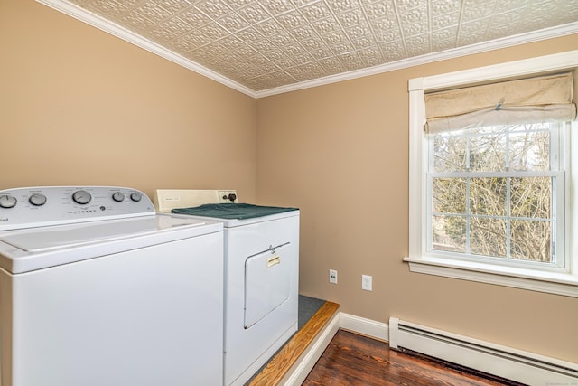 clothes washing area featuring laundry area, separate washer and dryer, an ornate ceiling, crown molding, and baseboard heating