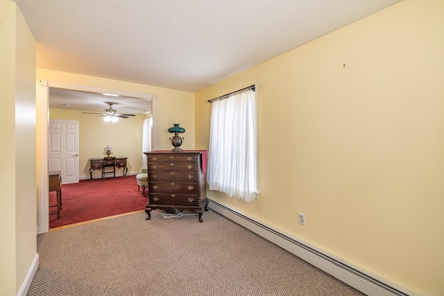 sitting room featuring ceiling fan, carpet, baseboards, and a baseboard radiator