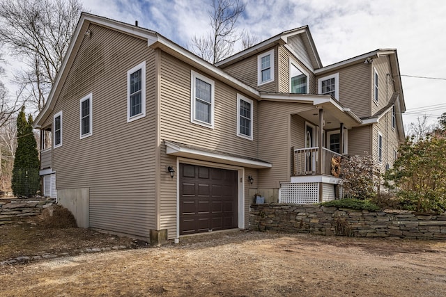 exterior space featuring driveway and an attached garage