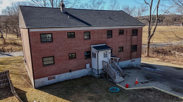 223 Rte 169, Woodstock, CT 06281 - rear view of property featuring brick siding, crawl space, a chimney, and roof with shingles