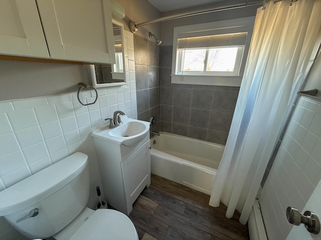 223 Rte 169, Woodstock, CT 06281 - bathroom featuring toilet, wood finished floors, tile walls, shower / tub combo, and vanity