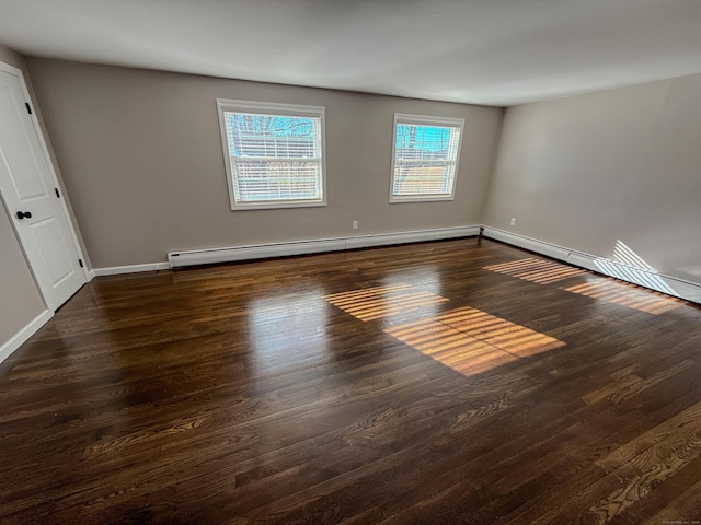 223 Rte 169, Woodstock, CT 06281 - empty room with a baseboard heating unit, baseboards, and wood finished floors