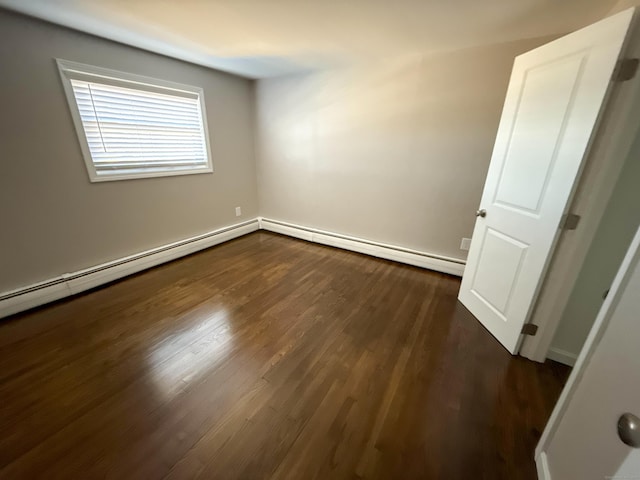 223 Rte 169, Woodstock, CT 06281 - unfurnished room with a baseboard radiator and dark wood finished floors