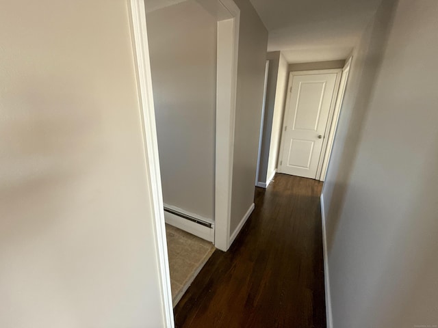 223 Rte 169, Woodstock, CT 06281 - corridor with dark wood-type flooring, baseboards, and a baseboard radiator